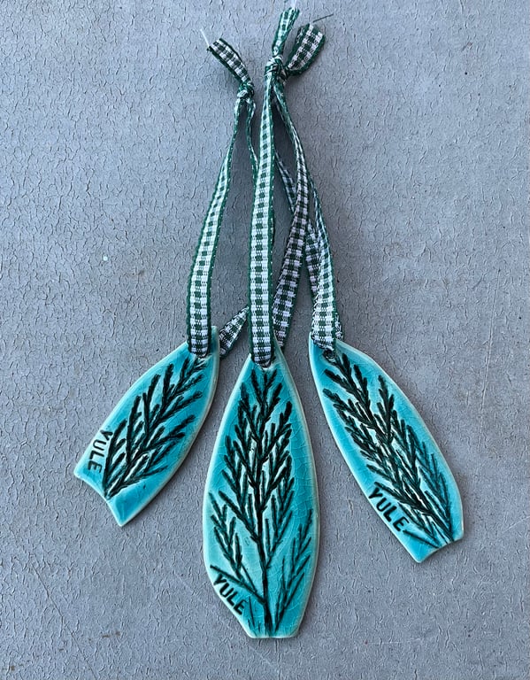 Set of three ceramic Yule decorations .