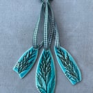 Set of three ceramic Yule decorations .