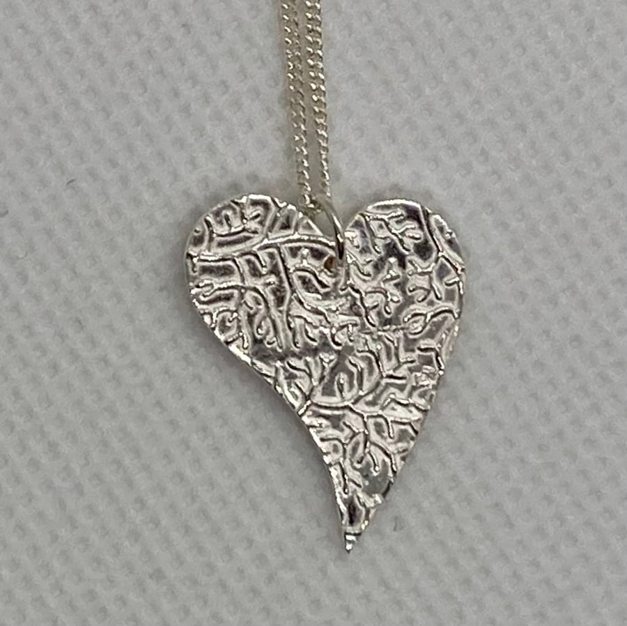 Pretty, pure silver heart necklace. 