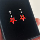 Enamel star earrings on silver hoops