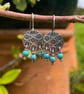 Oxidised silver round flower earrings with turquoise dangles