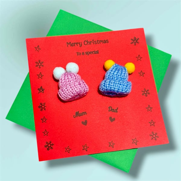 Fun Christmas card for a special mum and dad with cute Pom Pom bobble hats