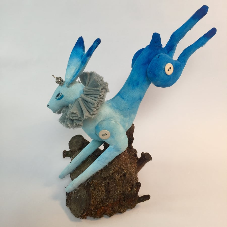 Textile blue hare leaping.