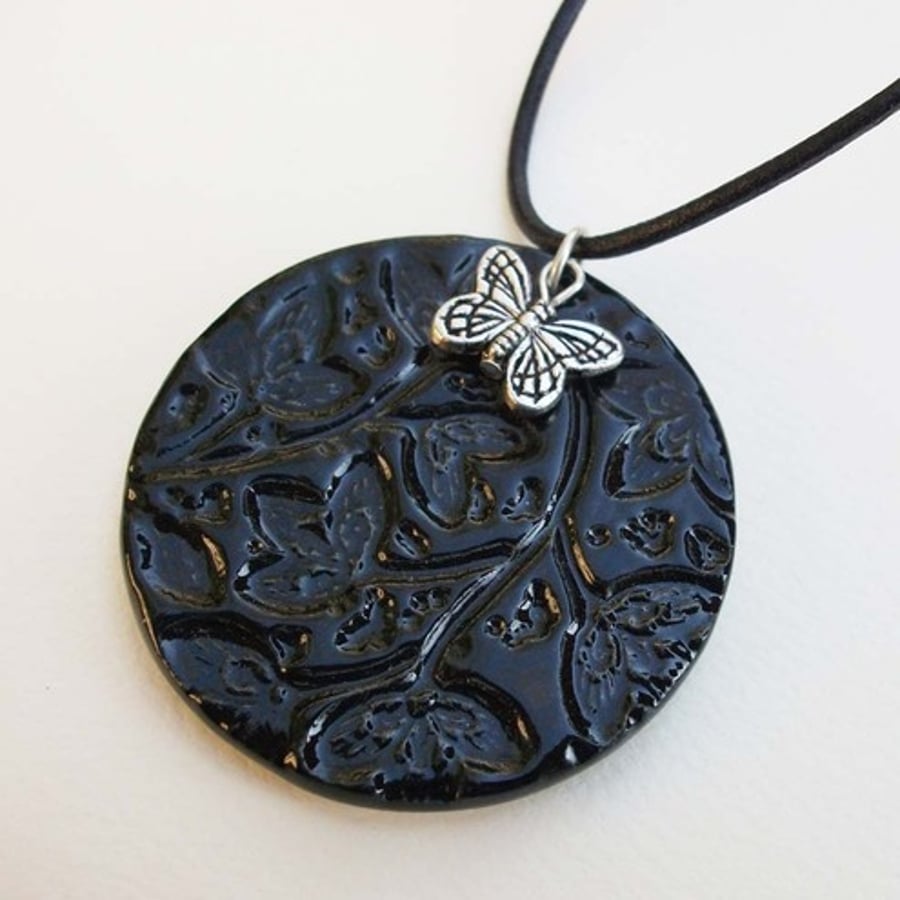 black ceramic pendant with butterfly