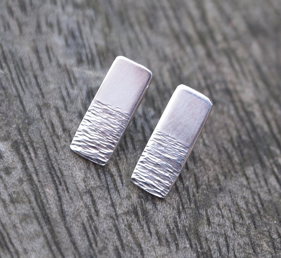 silver studs, shimmering water
