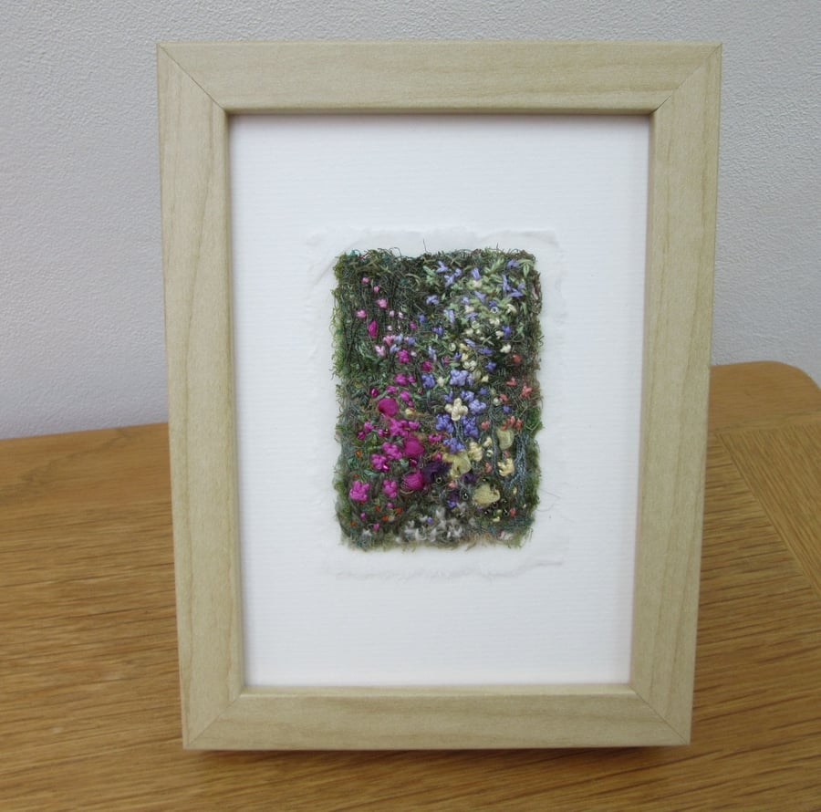 EMBROIDERED FLOWER GARDEN PICTURE in light wood frame