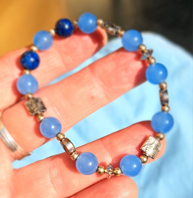 Light and dark blue beaded elasticated bracelet. Spiritual gemstones
