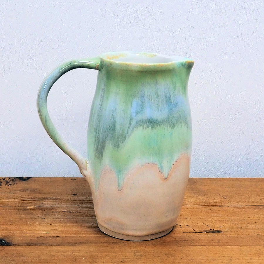Stoneware pottery jug, multi-colour greens and cream glaze