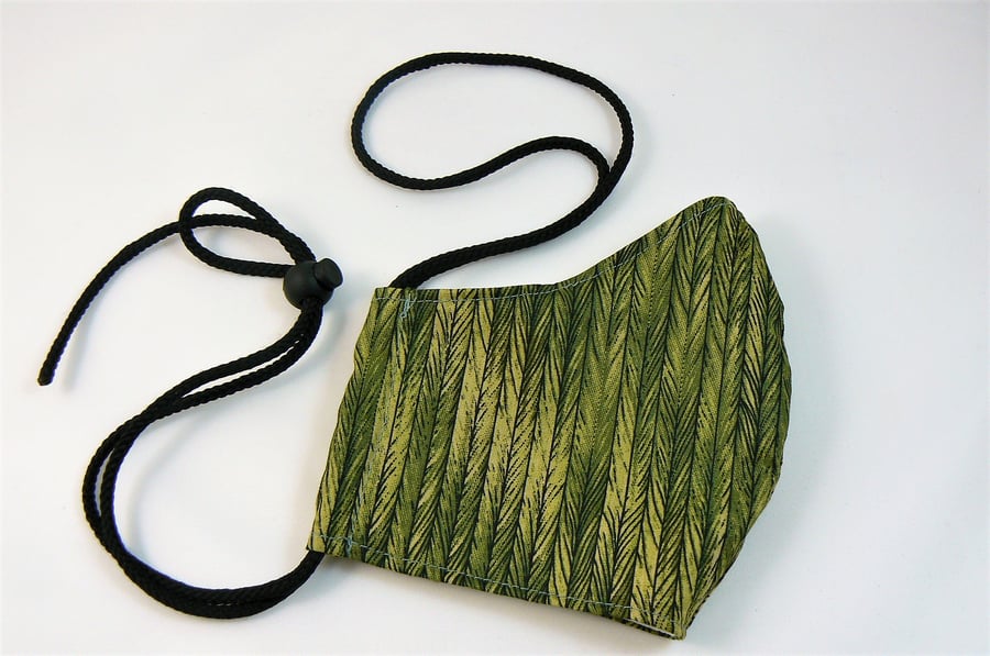 Face mask with removable nose wire , filter pocket  and drawstring toggle