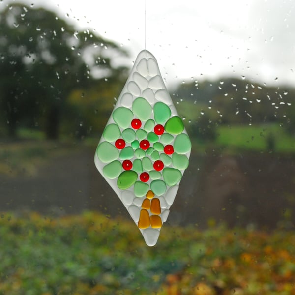 Sun catcher of apple tree in beach glass