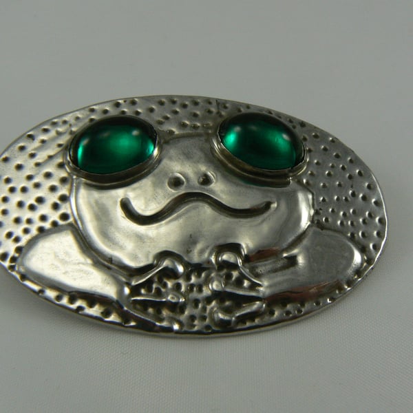 Pewter frog Brooch with green cabochon eyes