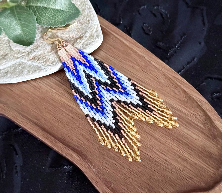 Handmade beadwork fringe earrings in a blue and copper chevron design