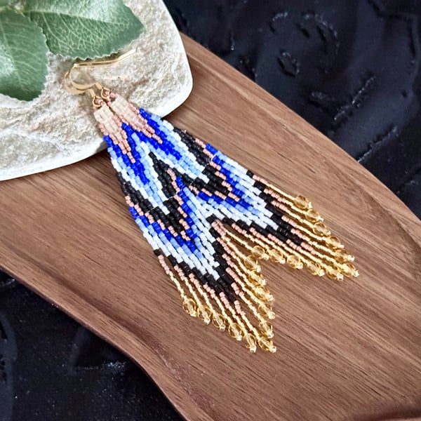 Handmade beadwork fringe earrings in a blue and copper chevron design