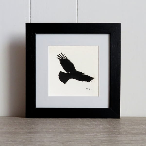 Courting Crow 2, original charcoal pencil drawing of a flying crow, framed.