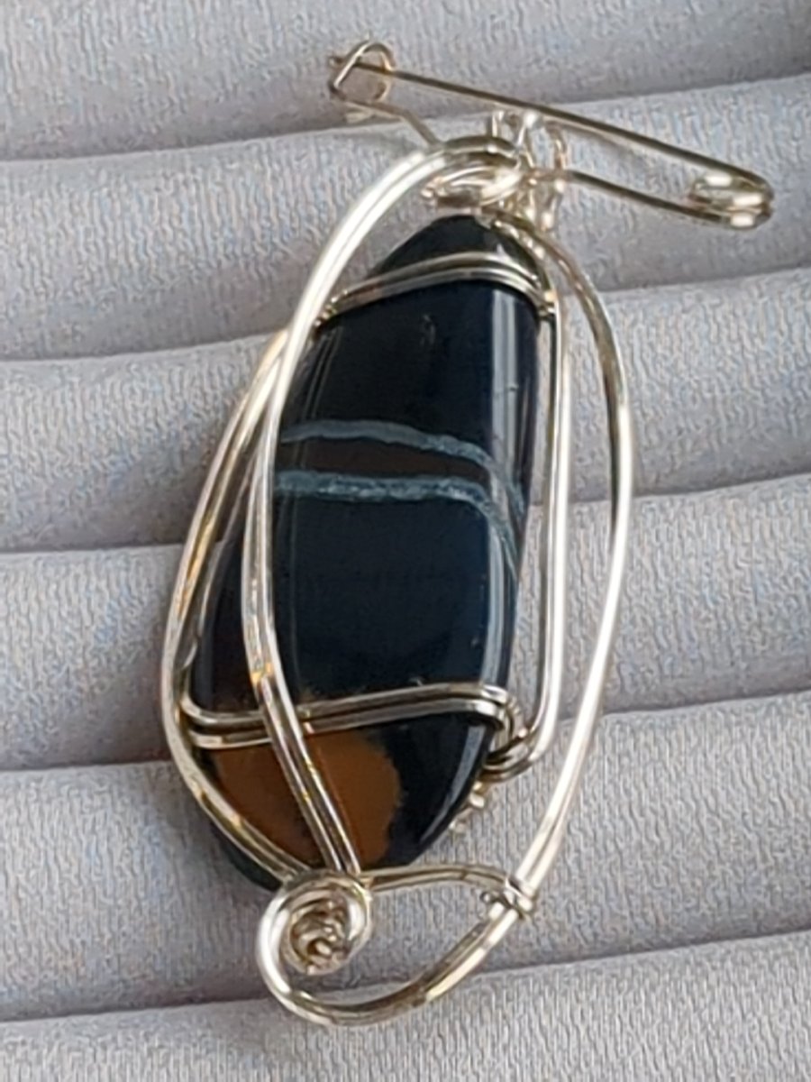 South African agate pendant in sterling silver with pin attachment. 