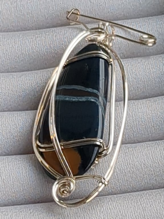 South African agate pendant in sterling silver with pin attachment. 