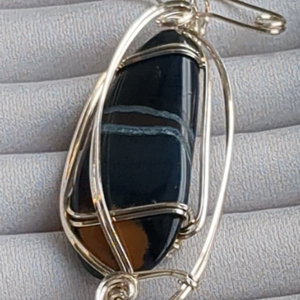 South African agate pendant in sterling silver with pin attachment. 