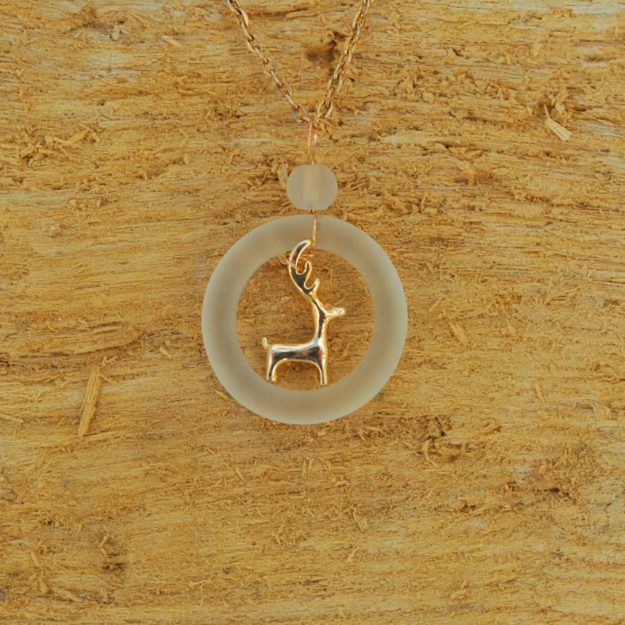 Golden deer in glass ring pendant