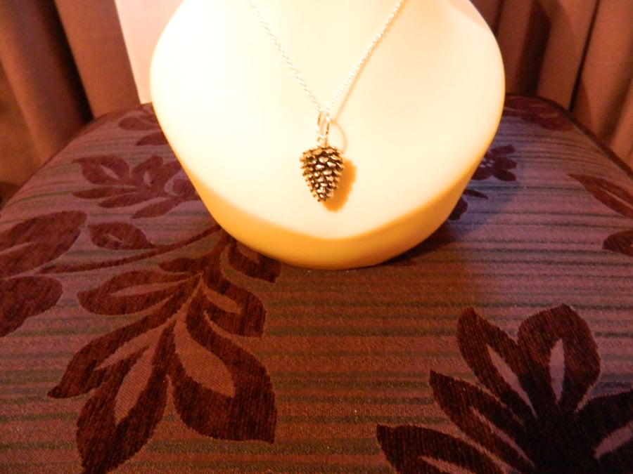 A Christmas Pine Cone on a silver chain - Costume Jewellery