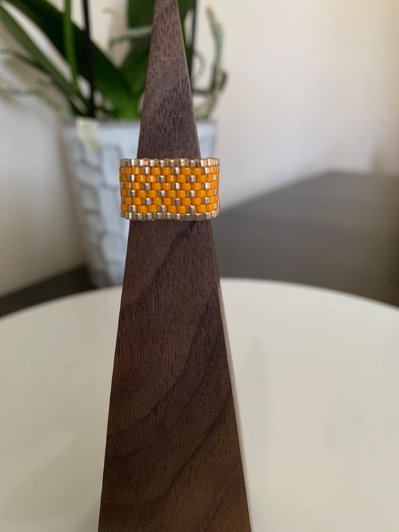 Luminous orange and gold coloured beaded ring