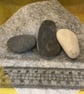 Set of 3 hand painted pebbles with floral designs. - Image 2