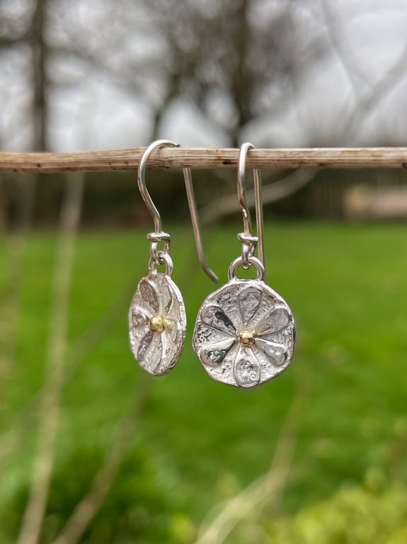 Small sterling silver flower earrings with gold centres