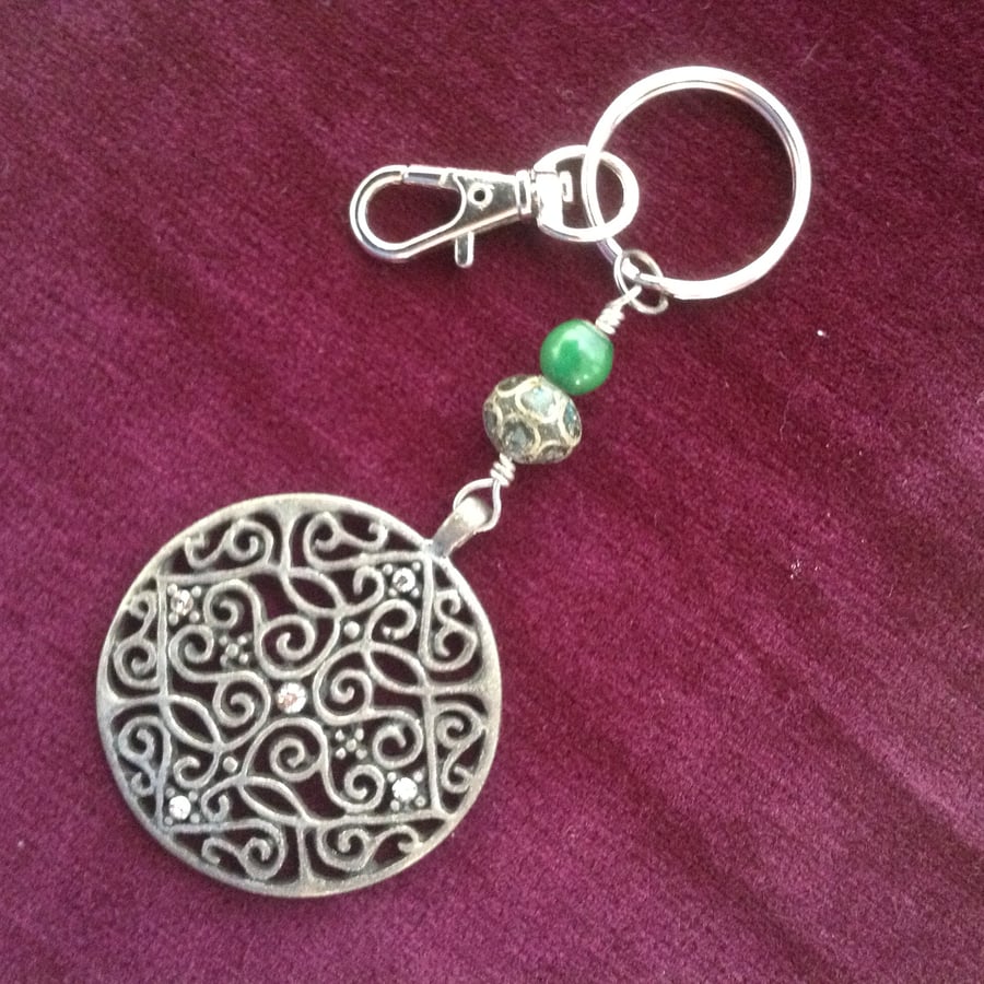 Keyring or handbag charm with a vintage pendant and beads