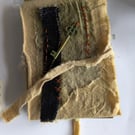 Junk journal made with envelopes and tags binding 