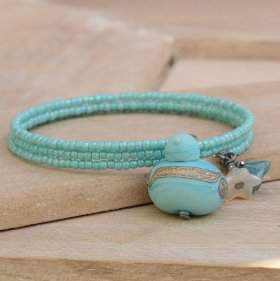 Turquoise Memory Wire Seed Bead Bracelet with Aqua Lampwork Glass Bird & Flowers