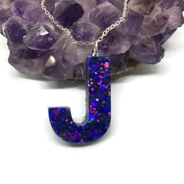 Capital J initial letter sparkly green resin pendant on silver plated chain.