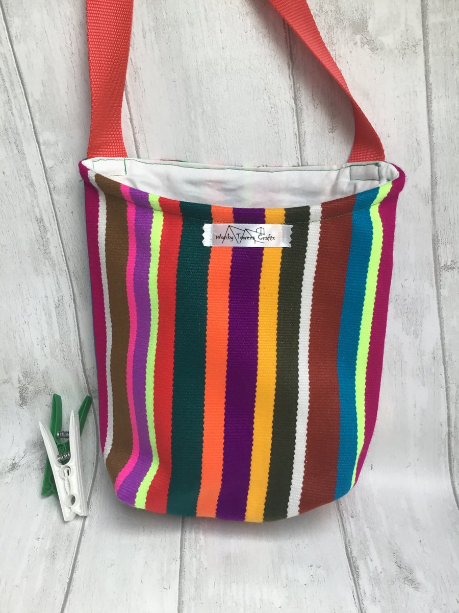 Peg bag with shoulder strap for easy laundry hanging. Ecuadorian stripes.