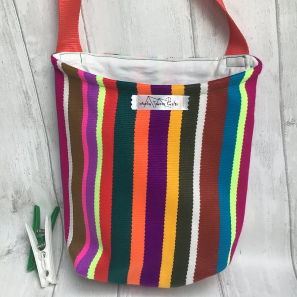 Peg bag with shoulder strap for easy laundry hanging. Ecuadorian stripes.