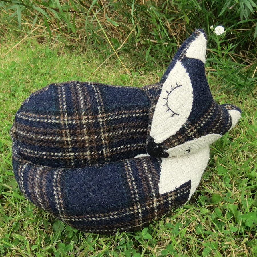 A snoozy fox doorstop.  Fox bookend.