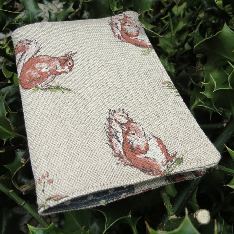 A passport sleeve with a squirrels design. Passport cover.