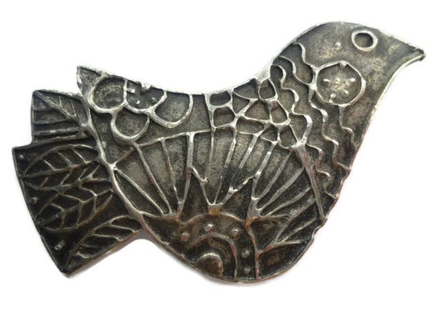 Bird brooch pin.