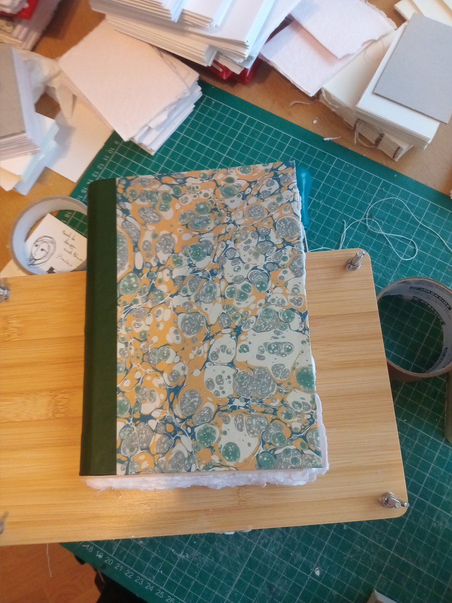 A5 pamphlet stitch cotton rag sketchbook with leather spine and printed marbled 