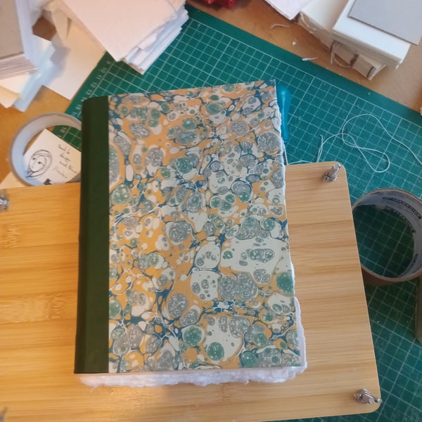 A5 pamphlet stitch cotton rag sketchbook with leather spine and printed marbled 