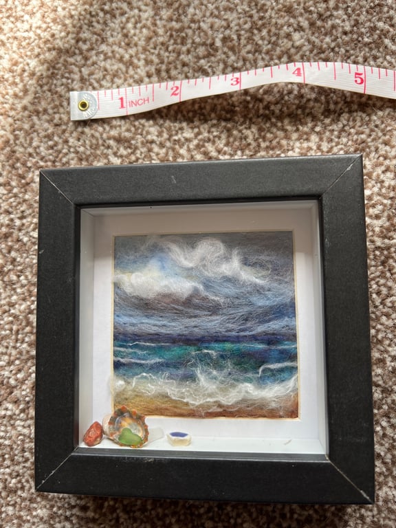 Beach scene cloudy sky, waves and sand needle felt black frame Seaglass shells