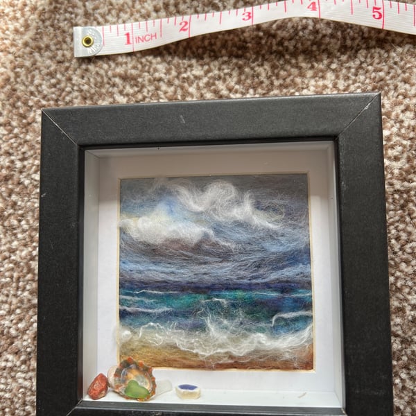 Beach scene cloudy sky, waves and sand needle felt black frame Seaglass shells