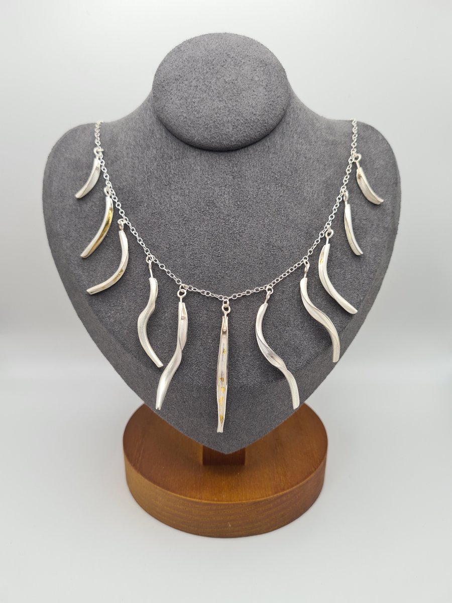Multi pod silver necklace