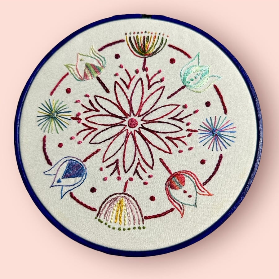 Embroidered floral hoop in bright colour change thread making each flower unique
