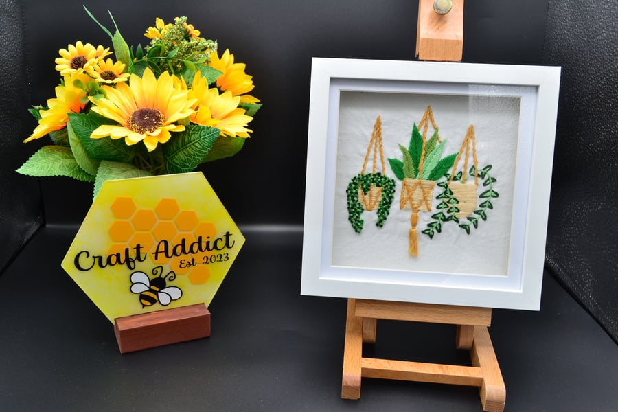 Framed hand stitched artwork