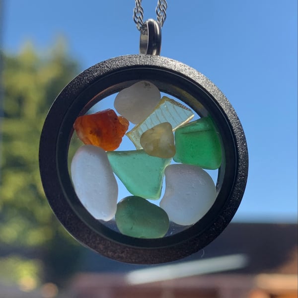 Frosted stainless steel locket filled with seaglass pieces