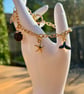 Gold Tone Charm Bracelet - Image 1