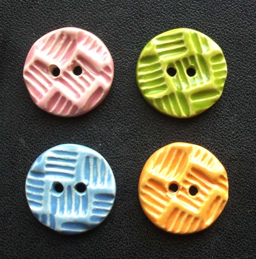 Set of four little handmade ceramic buttons