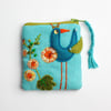 Turquoise linen coin purse with hand embroidered bird and hollyhock