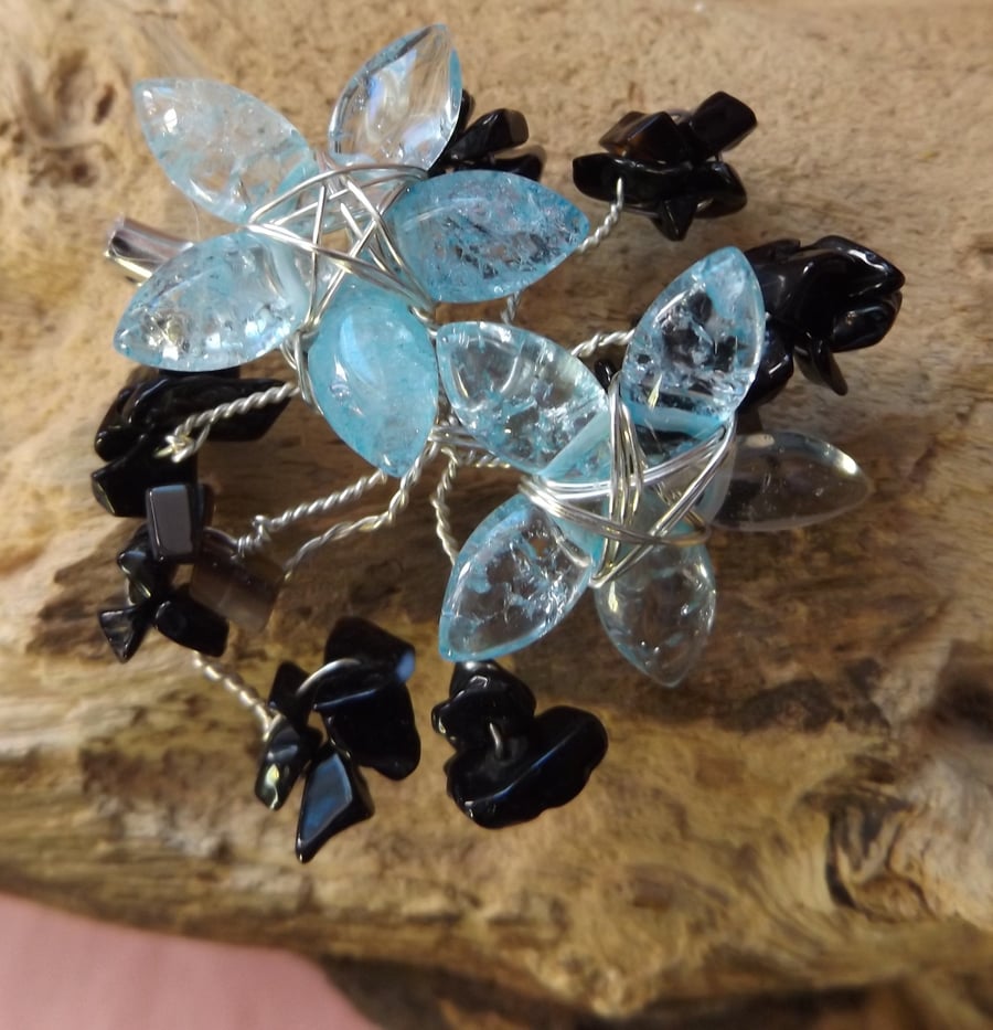 Blue quartzite flower brooch with black onyx