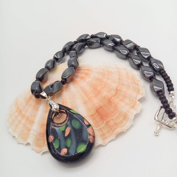 Black Teardrop Shaped Glass Pendant on a Haematite and Glass Bead Necklace