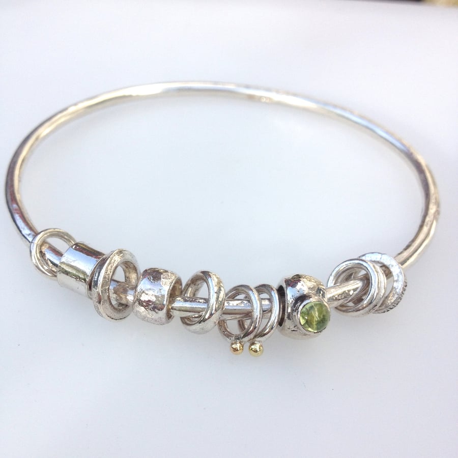  Silver peridot and 18ct gold bangle