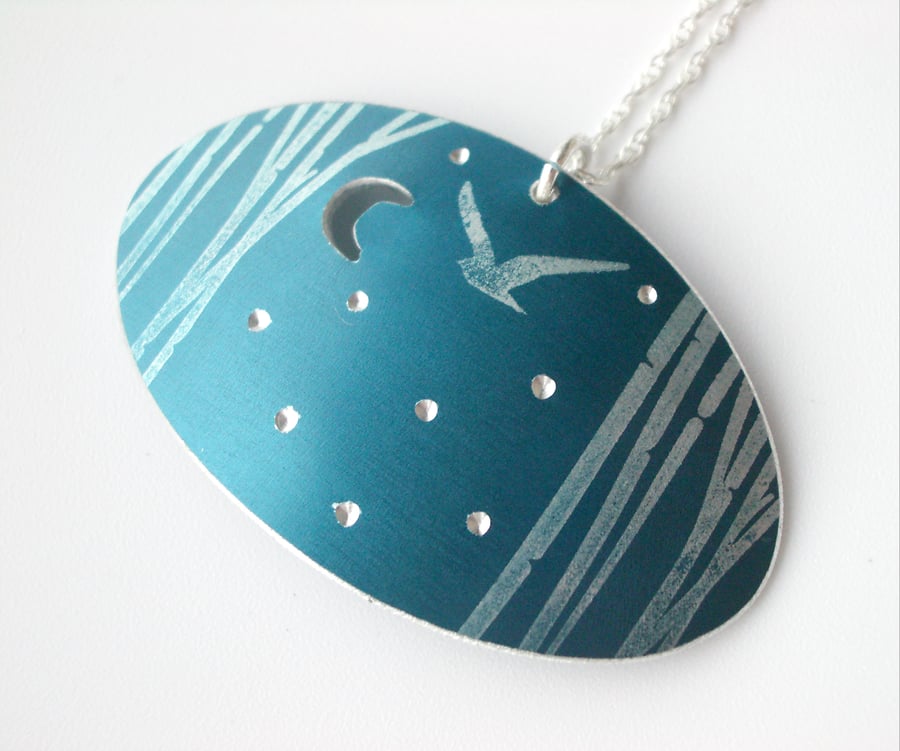 Bird in trees oval pendant in teal